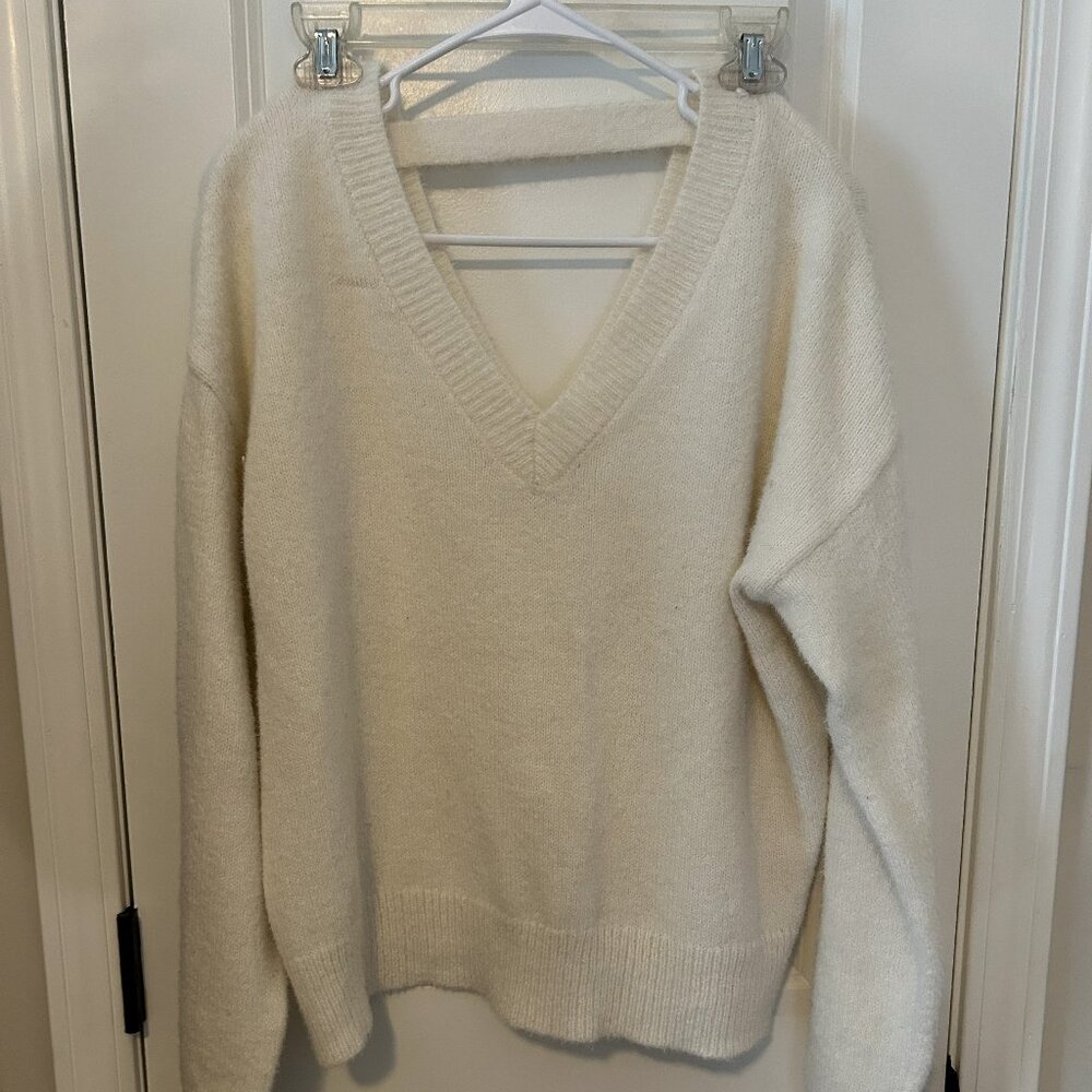 Cream fuzzy sweater, open back and v neck